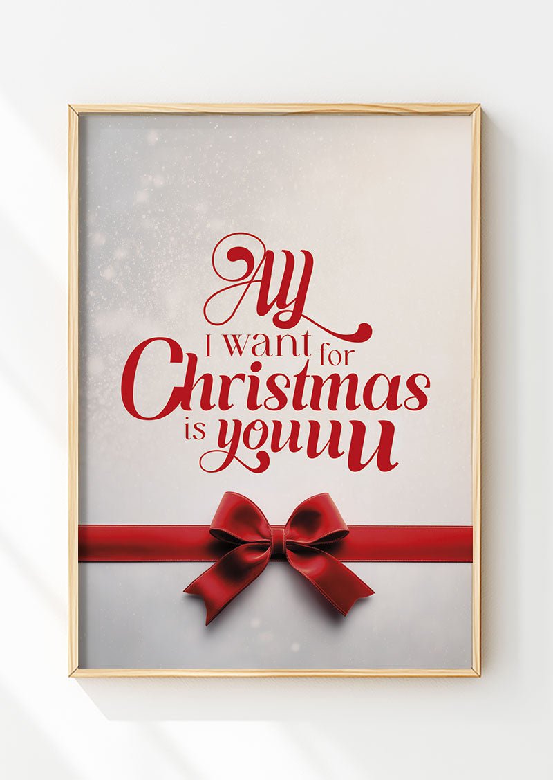 Affiche de noël typographie et nœud rouge "all i want" encadrée dans un cadre en bois
