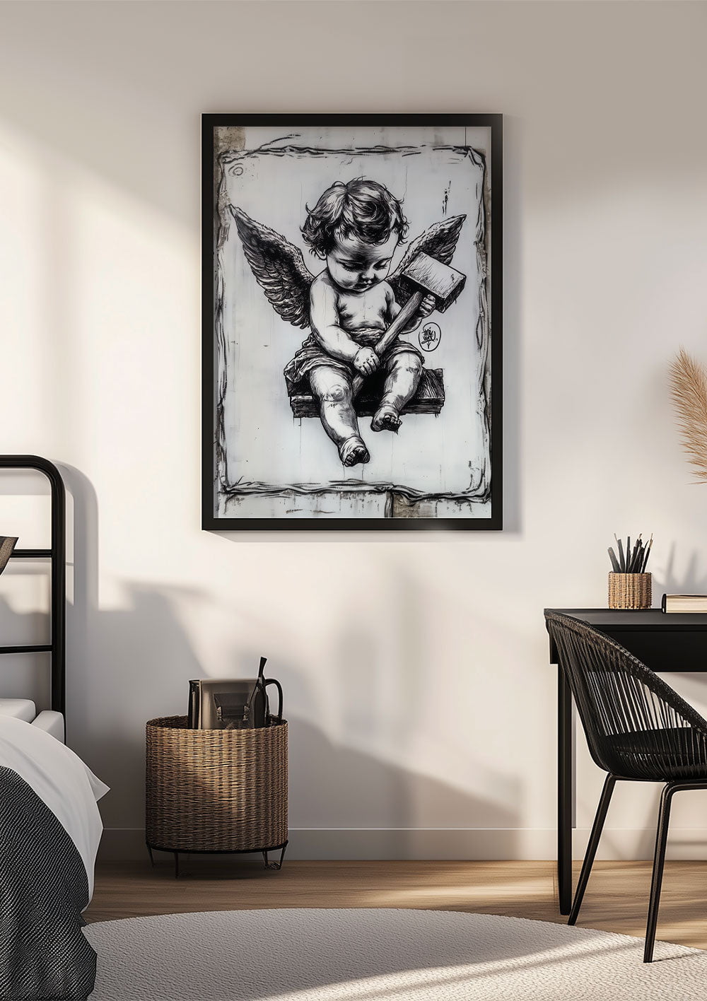 Affiche street-art du chérubin en noir et blanc encadrée sur le mur d'une chambre.