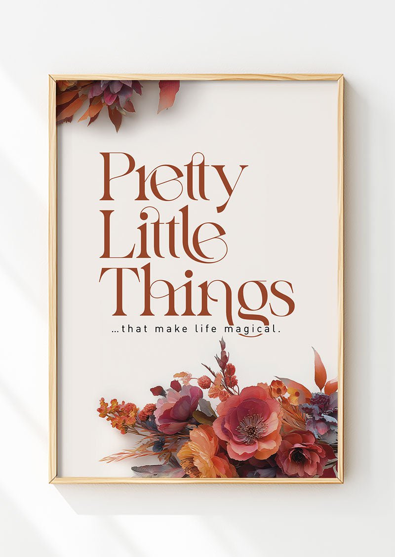 Affiche automne illustrant des fleurs aux tons chauds et un texte en marron, dans un cadre en bois