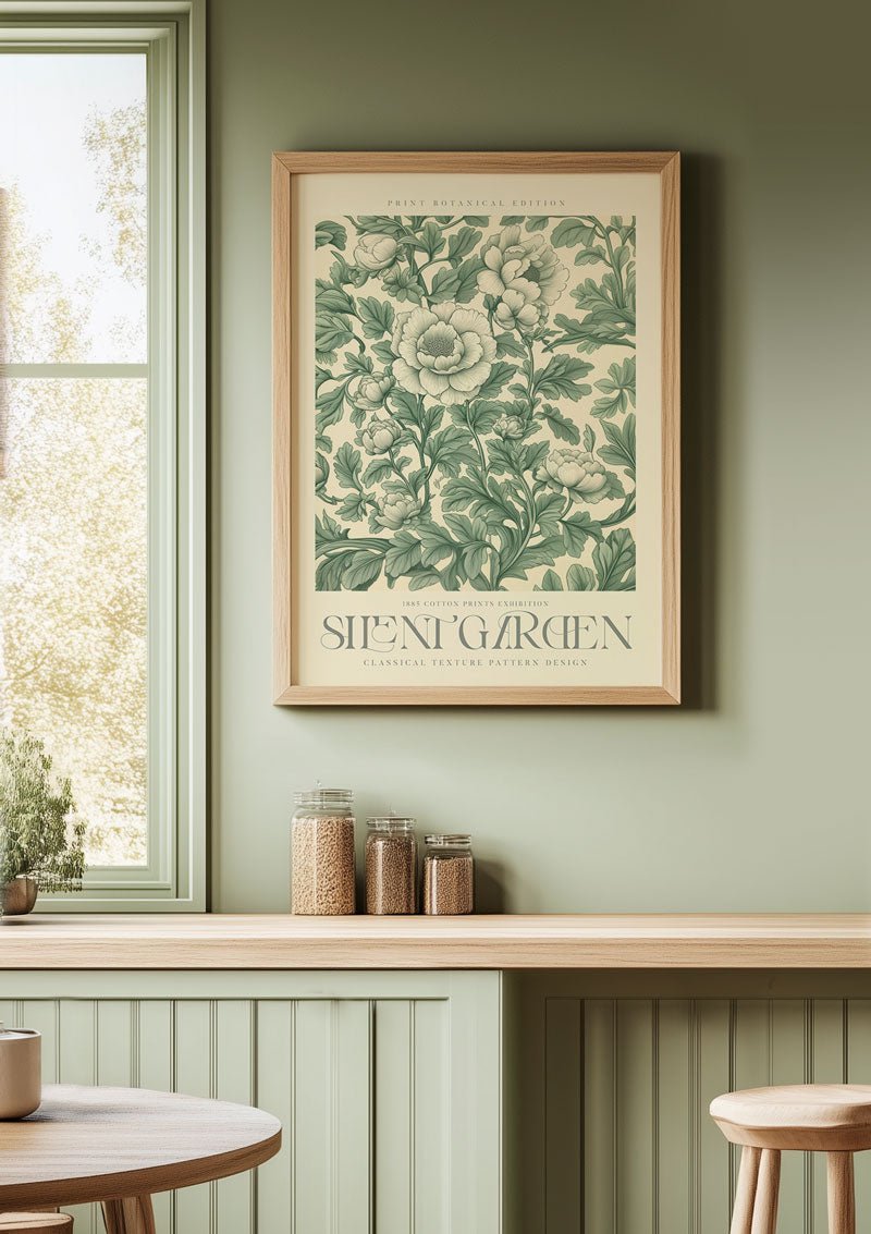 Affiche murale william morris, silent garden 1, sur un mur vert amande dans une cuisine.