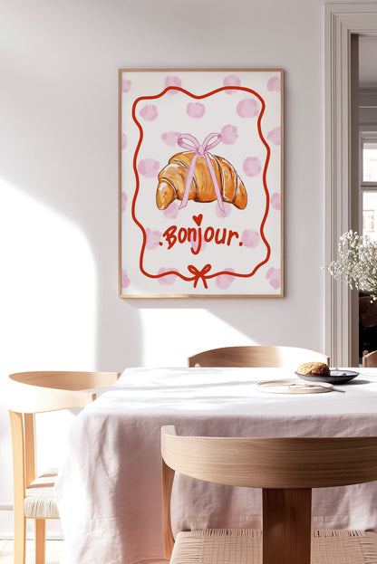 Affiche cuisine d'un croissant avec la typo "bonjour" encadrée sur le mur d'une cuisine