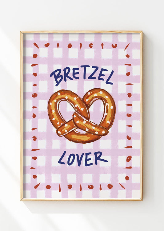 Affiche cuisine d'un bretzel sur fond à carreaux rose encadrée dans un cadre en bois