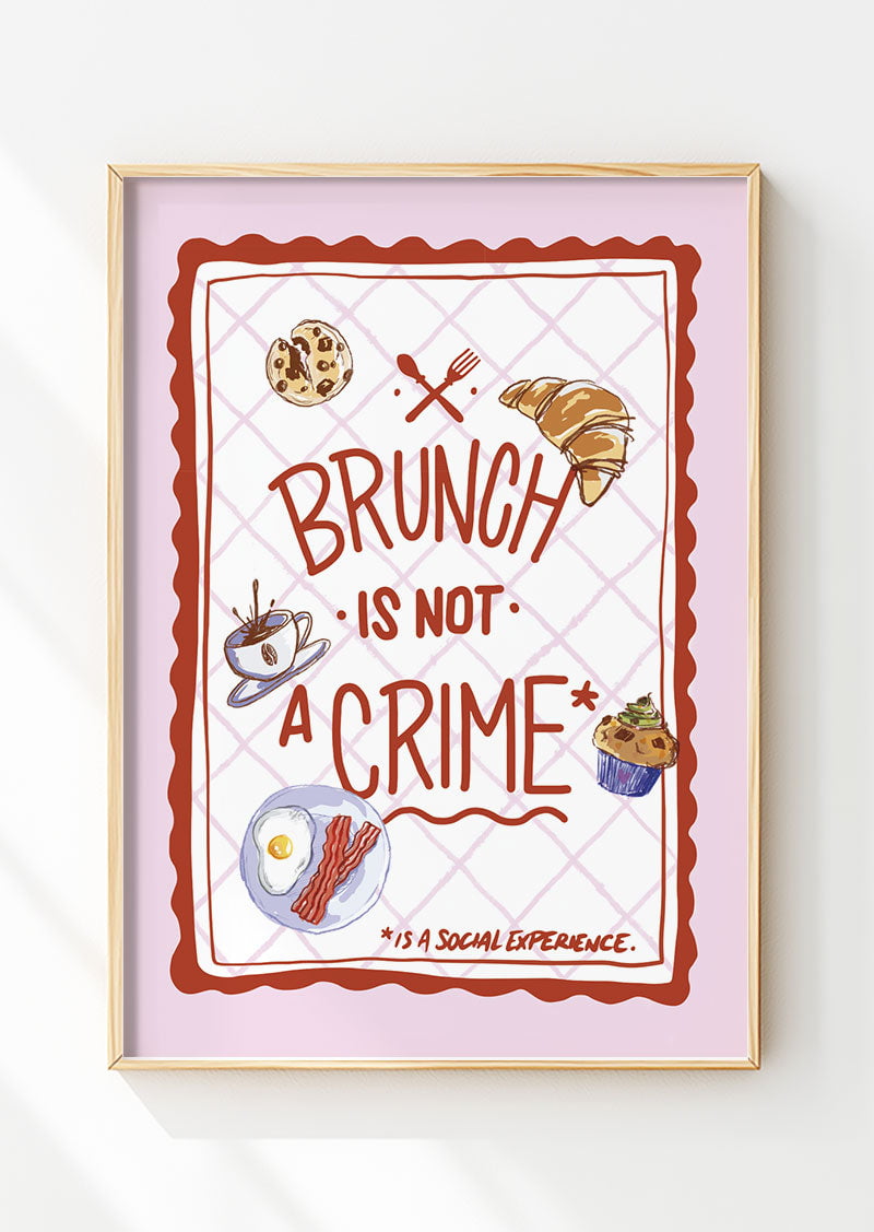 Affiche cuisine "brunch is not a crime" sur fond quadrillé et bordure rose dans un cadre en bois