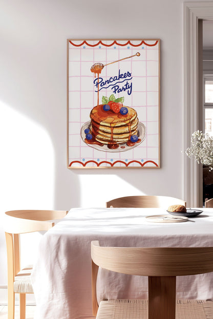 Affiche cuisine pancakes party sur fond quadrillé encadrée sur le mur d'une cuisine
