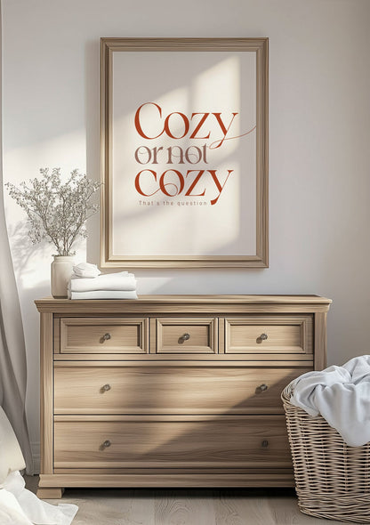 Affiche automne "cozy or not cozy" encadrée au dessus d'un meuble en bois