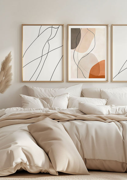 L'affiche murale contemporaine composées de lignes fluides encadrée dans une chambre.