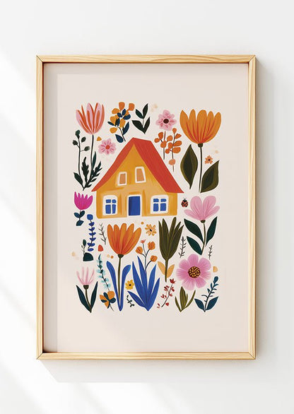Affiche folk art dans un cadre en bois  avec un dessin d'une maison orange entourée de fleurs 