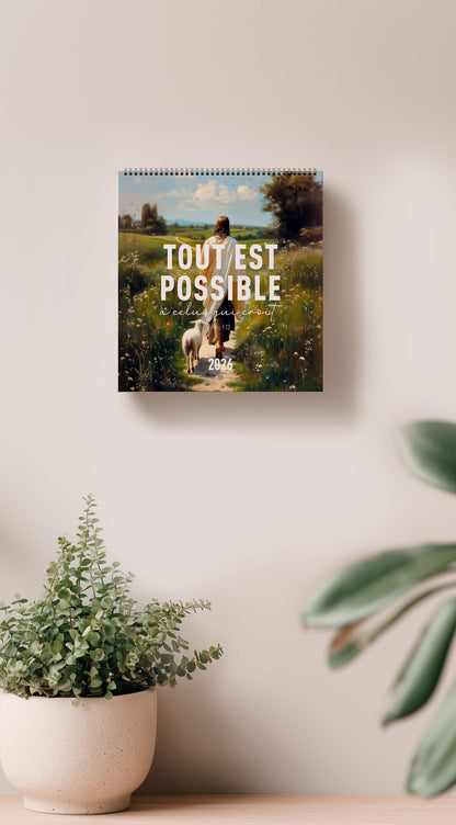 Calendrier chrétien 2026 mis en scène sur un mur, montrant la couverture avec jésus et un verset