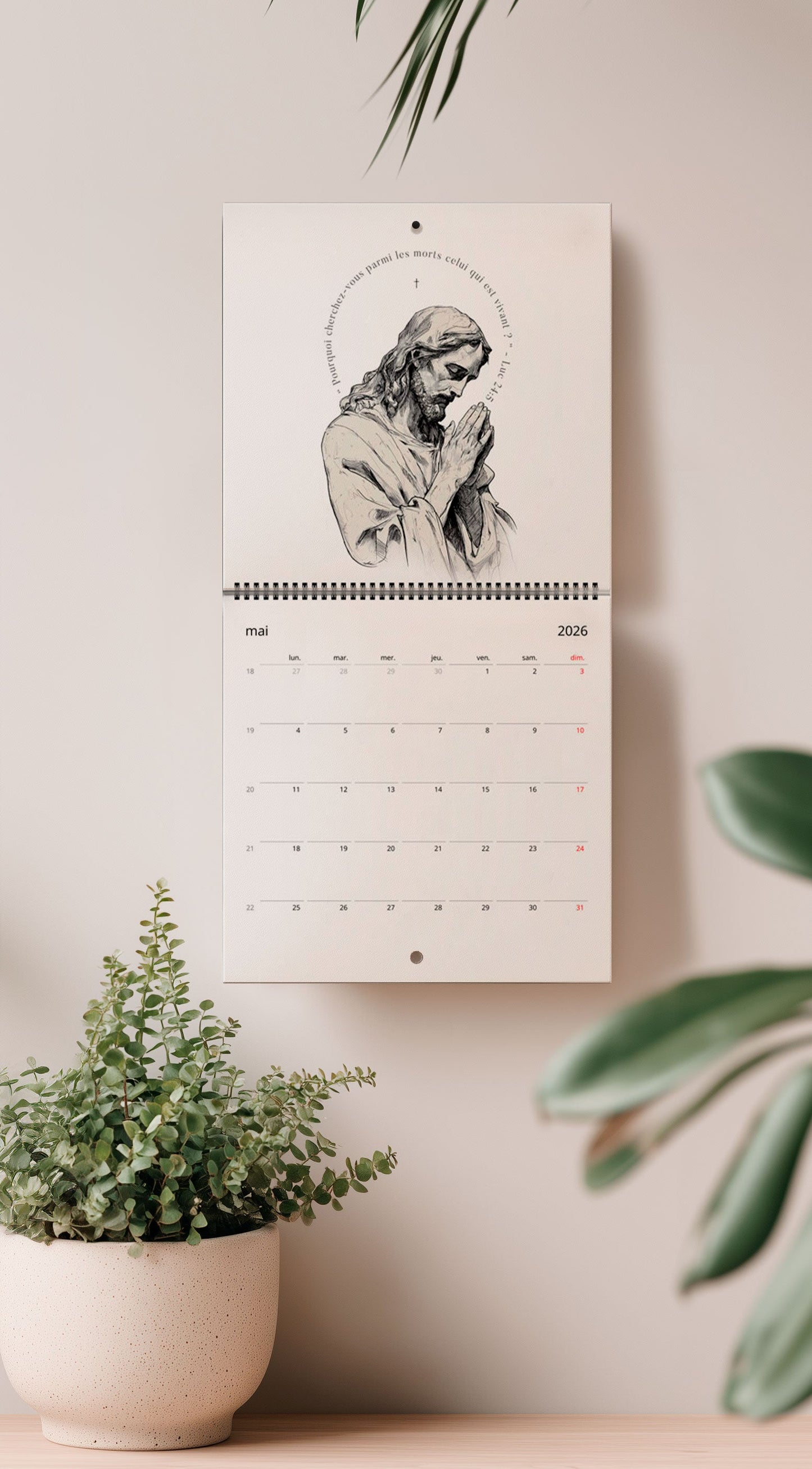 Mise en situation du calendrier avec un dessin de jésus en noir et blanc, et un verset